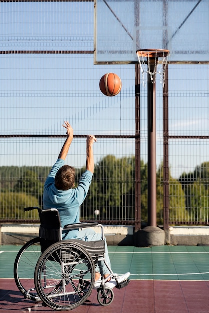 Full shot man playing basketball