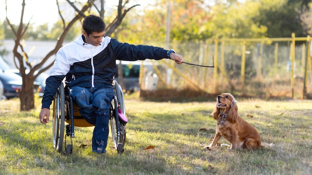 Free Photo full shot man playing with dog