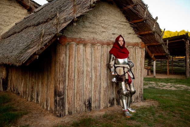 Free photo full shot man posing as a medieval soldier