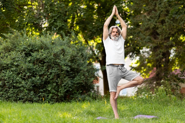 Full shot man practicing outdoors