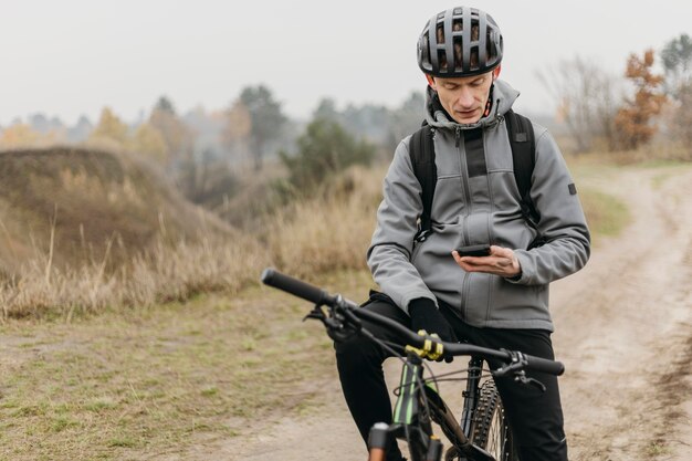 Full shot of man riding a bike