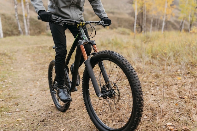 Full shot of man riding a bike