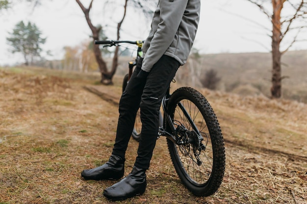 Full shot of man riding a bike