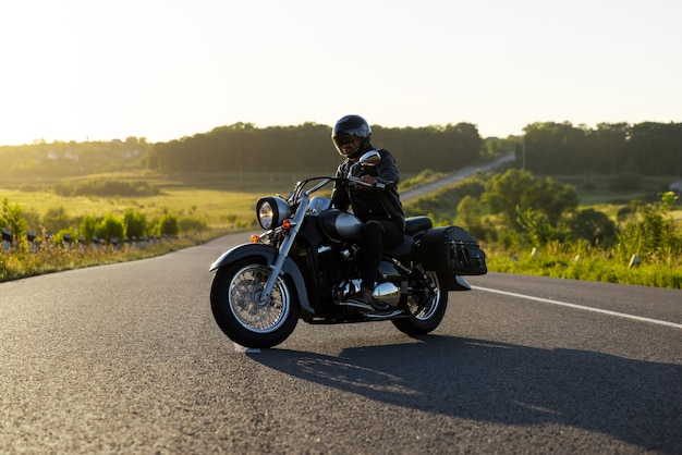 Free photo full shot man riding a motorbike