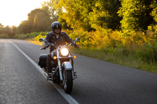 Free photo full shot man riding a motorbike