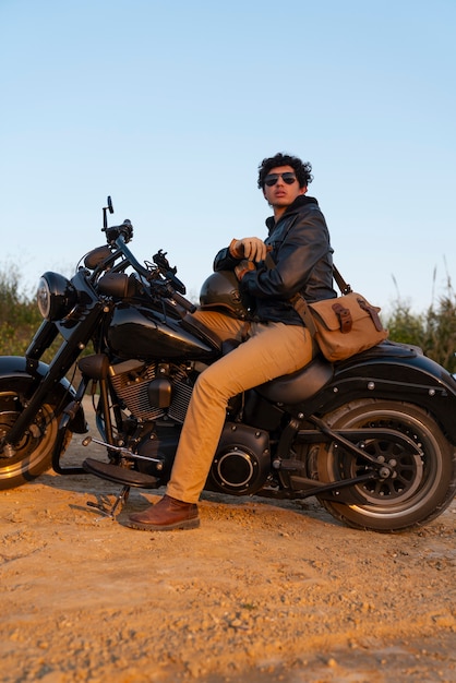 Free photo full shot man riding a motorbike