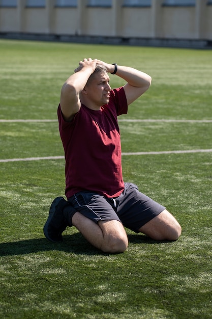 Free photo full shot man on soccer field