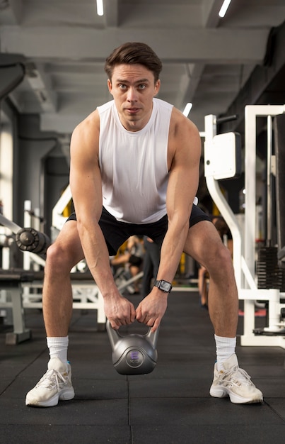 Full shot man training with kettlebell