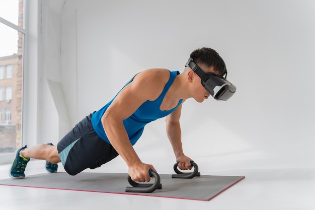 Full shot man training with vr glasses on