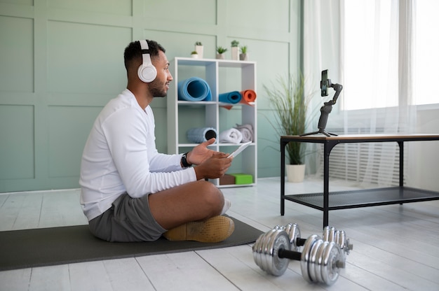 Full shot man wearing headphones