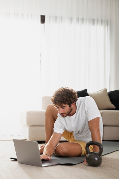 Full shot man with laptop