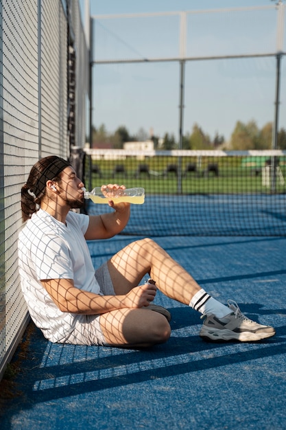 Free Photo full shot man with refreshing drink