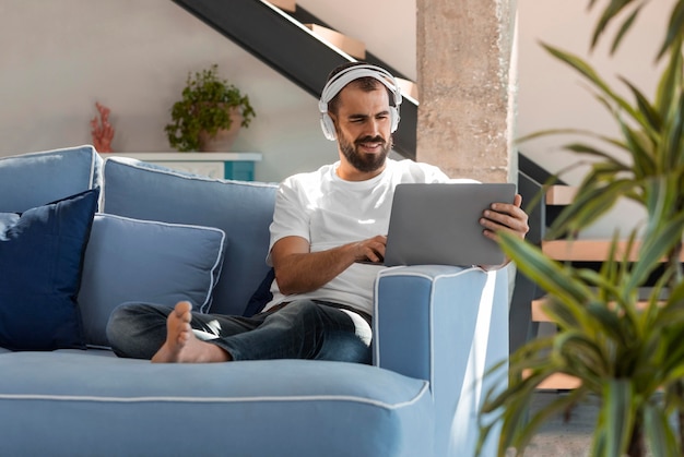 Free Photo full shot man working on couch