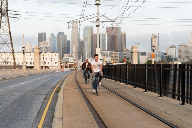 Full shot men riding bicycles