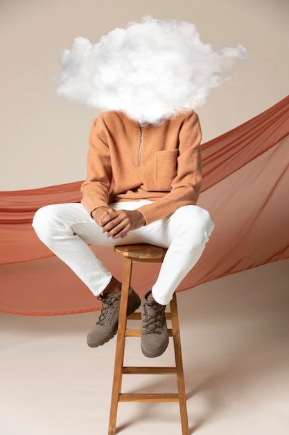 Full shot model posing with cloud-shaped head