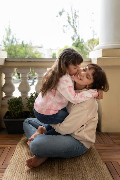 Full shot mother and daughter