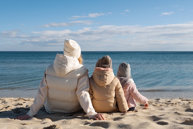 Full shot mother and kids at beach