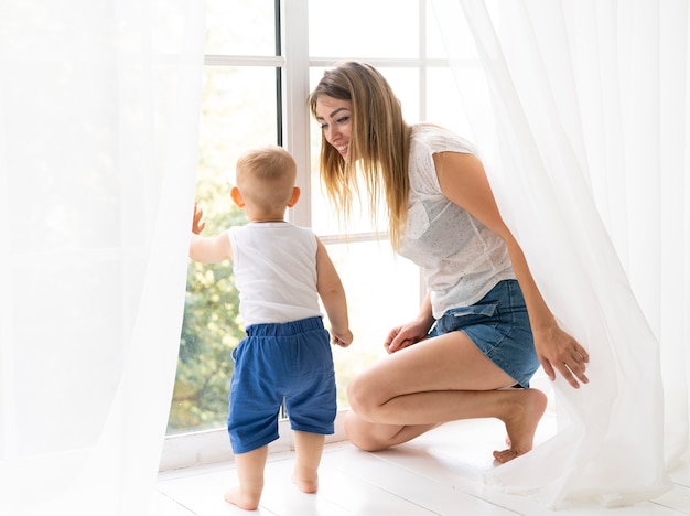 Full shot mother smiling at son