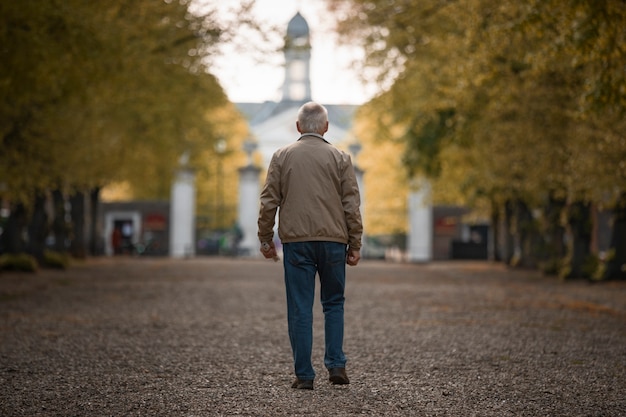 Full shot old man taking a stroll