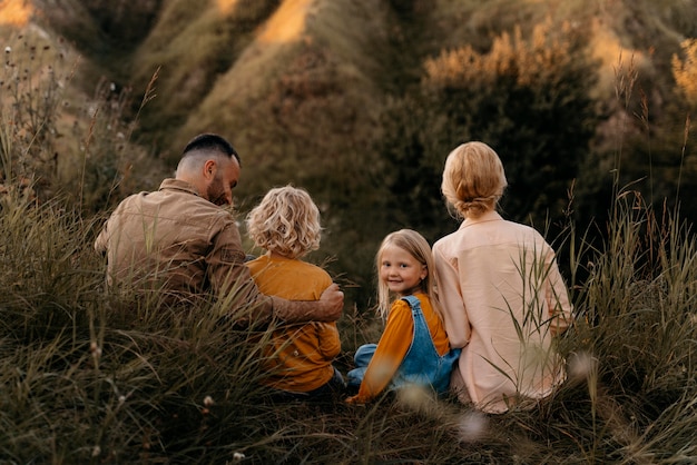 Free photo full shot parents and kids in nature