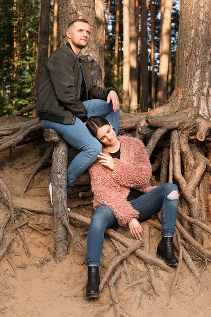 Full shot partners posing in nature