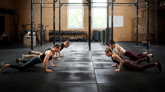 Full shot people doing burpees