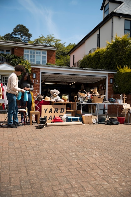 Free Photo full shot people at garage sale