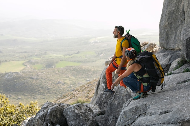 Full shot people hiking together