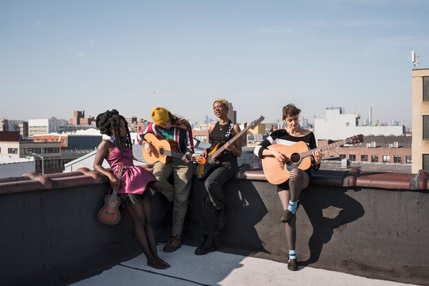 Full shot people holding instruments