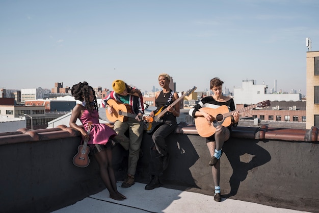 Full shot people holding instruments