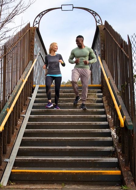 Free Photo full shot people running outdoors