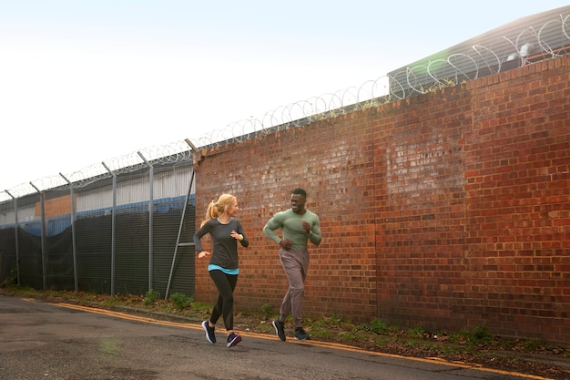 Full shot people running outdoors