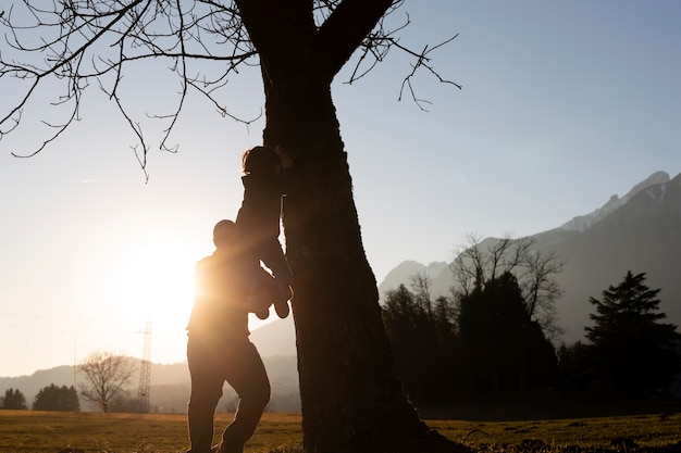 Free photo full shot people silhouettes in nature