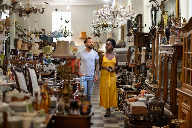 Free Photo full shot people walking in the antique store