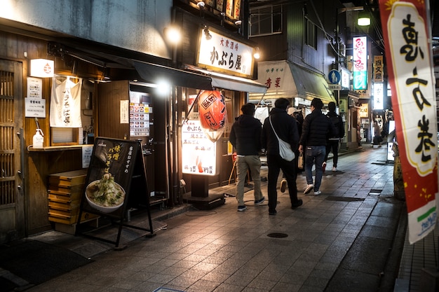 Full shot people walking at nighttime