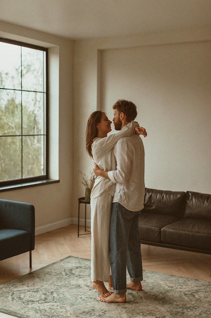 Full shot romantic couple indoors