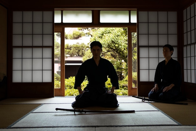 Free Photo full shot samurai meditating indoors