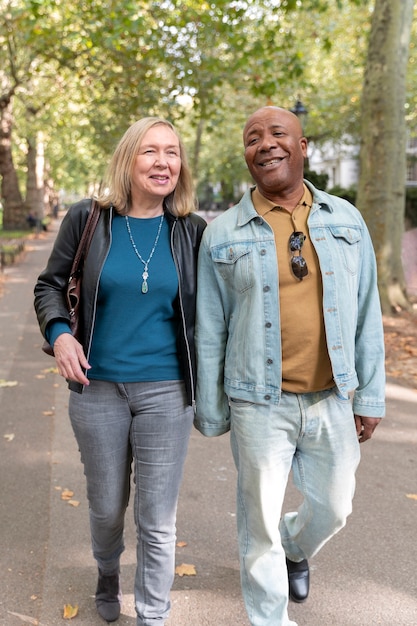 Full shot senior couple walking together