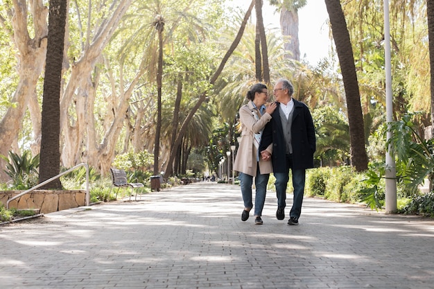 Free Photo full shot senior people walking together