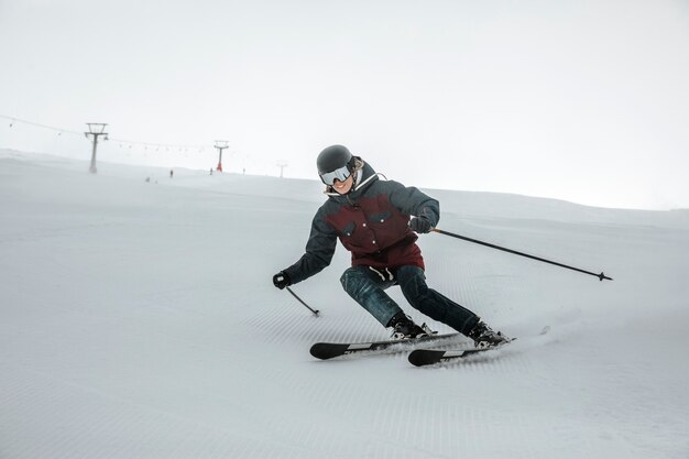 Full shot skier having fun outdoors