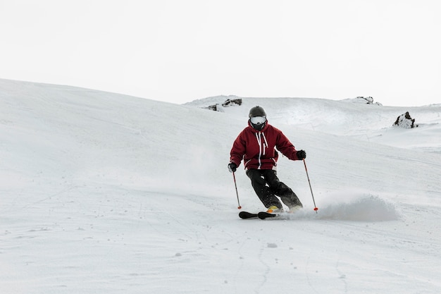 Full shot skier outdoors