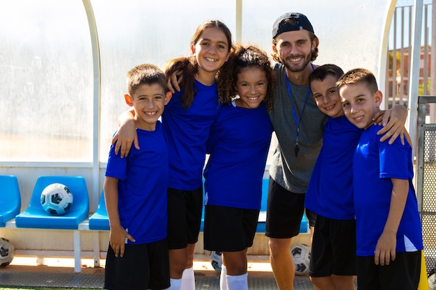 Free photo full shot smiley football team