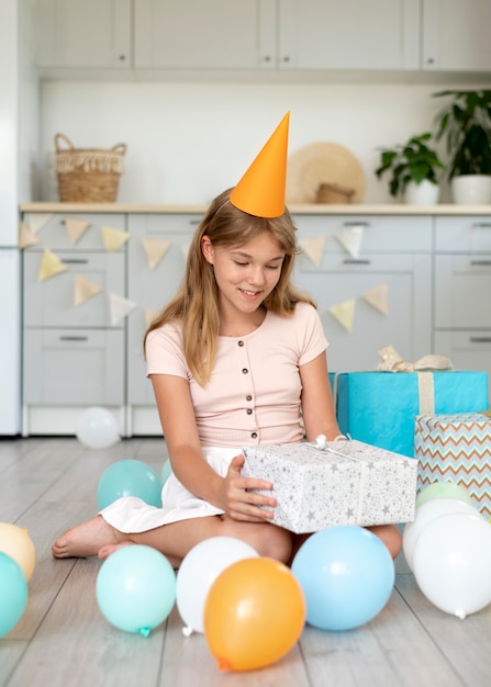 Full shot smiley girl holding gift