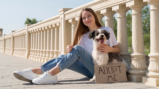 Free Photo full shot smiley girl sitting with cute dog