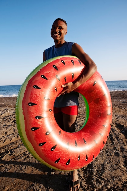 Free Photo full shot smiley man holding lifeline