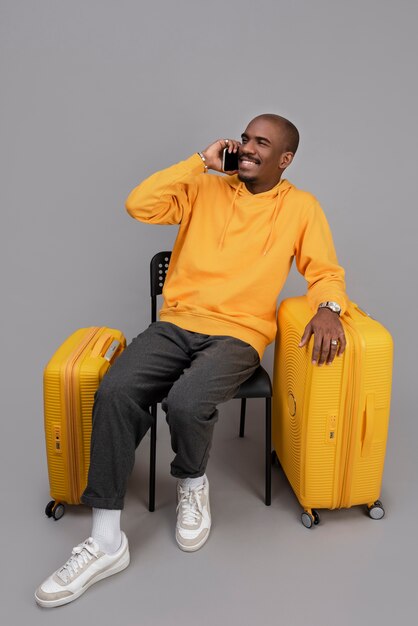 Full shot smiley man sitting on chair