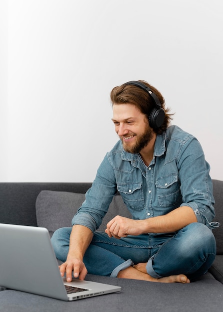 Full shot smiley man with headphones