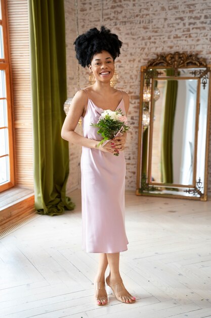 Full shot smiley woman holding bouquet