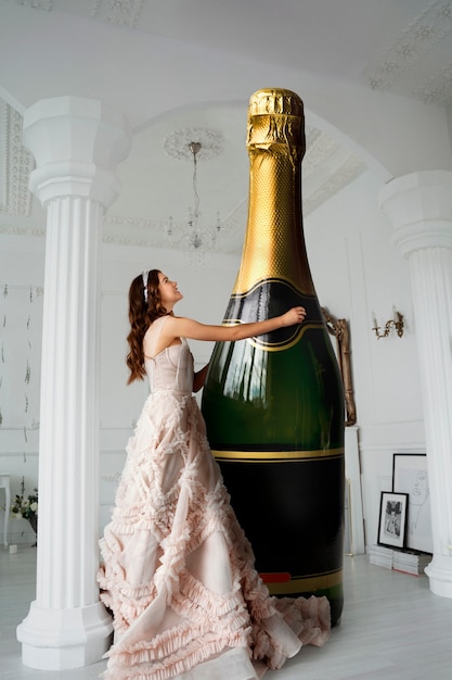 Full shot smiley woman holding giant bottle