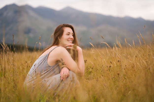 Full shot smiley woman in nature